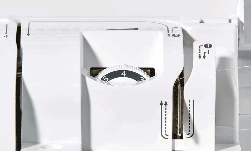 Close-up of the Brother Innov-is F420's adjustable thread tension dial, featuring clearly marked tension settings for precise sewing control.