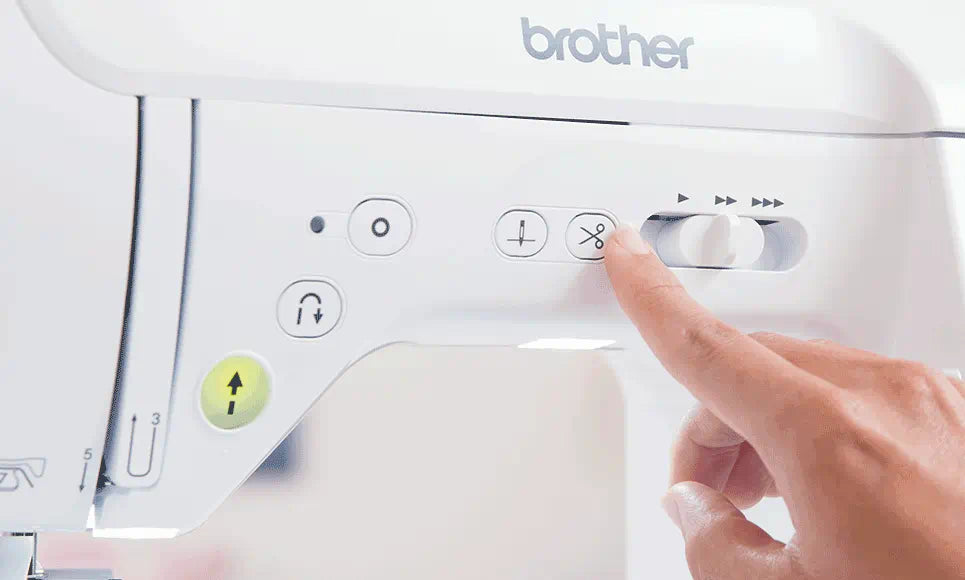 User operating the automatic thread cutter on the Brother Innov-is F420 sewing machine, demonstrating the ease of thread trimming.