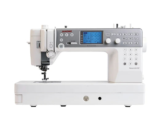 Front view of the Janome Memory Craft 6700P Sewing & Quilting Machine, displaying its full array of controls, backlit digital display, and professional finish.
