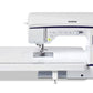 Frontal view of the Brother Innov-is NV1800Q sewing and quilting machine, complete with its wide table attachment, showcasing its sleek design and advanced control panel.