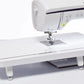 Alt description: "Brother Innov-is NV1800Q sewing and quilting machine featuring a large, extended wide table for increased workspace, with easy-to-access control panel and advanced needle threading system.