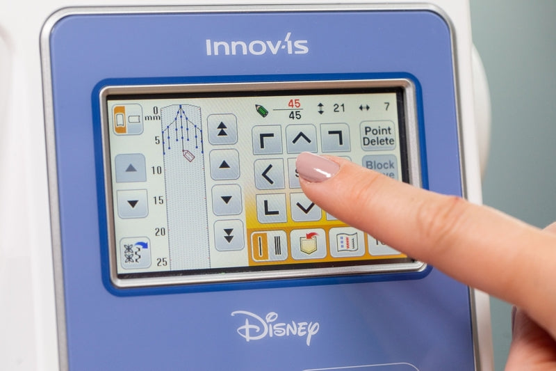 Brother Innov-is M380D: Close-up of LCD colour touch display demonstrating selection of pre-programmed stitch designs