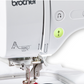 Brother Innov-is M380D: Close-up of machine head with easy to thread guides and one-touch button controls